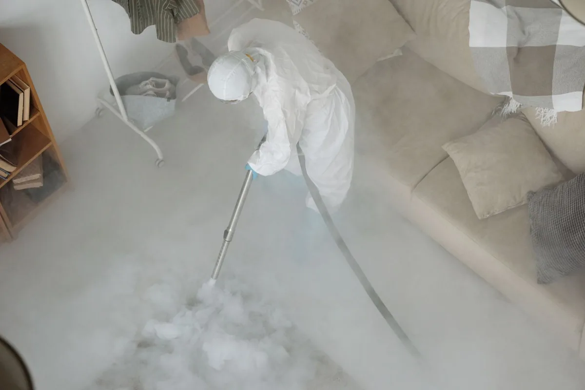 Biohazard cleanup technician in protective equipment, Baldwin City, KS
